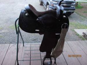 Brown horse saddle with foot straps